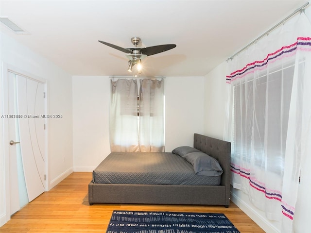 bedroom featuring ceiling fan and hardwood / wood-style floors