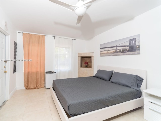 bedroom featuring ceiling fan and light tile patterned floors