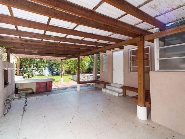 view of patio with a jacuzzi