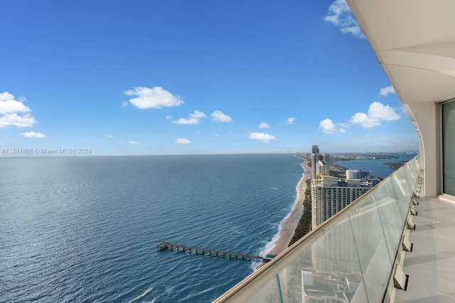 balcony featuring a water view