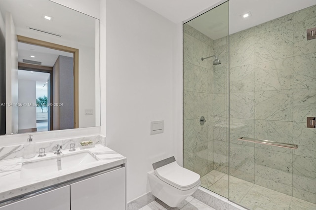 bathroom featuring toilet, a shower with door, tile floors, and vanity with extensive cabinet space