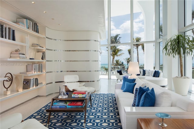 living room with plenty of natural light and expansive windows