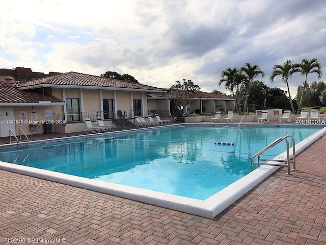 view of swimming pool with a patio area