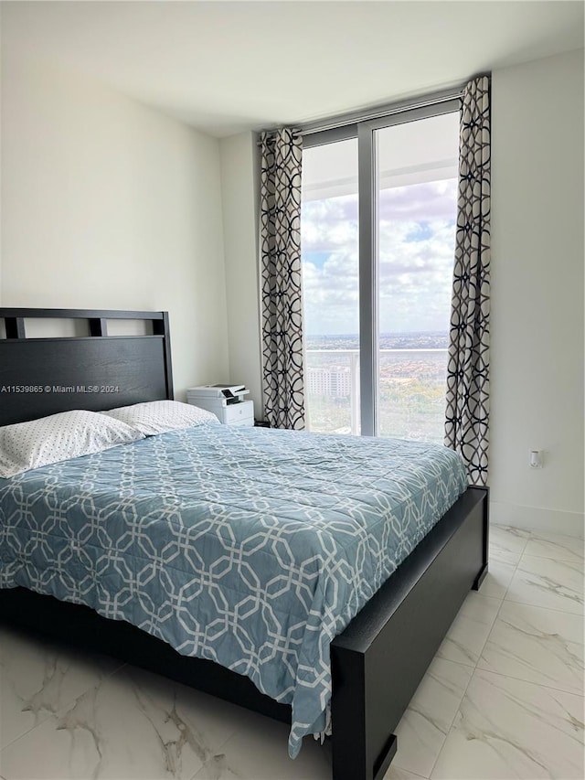 bedroom with light tile floors