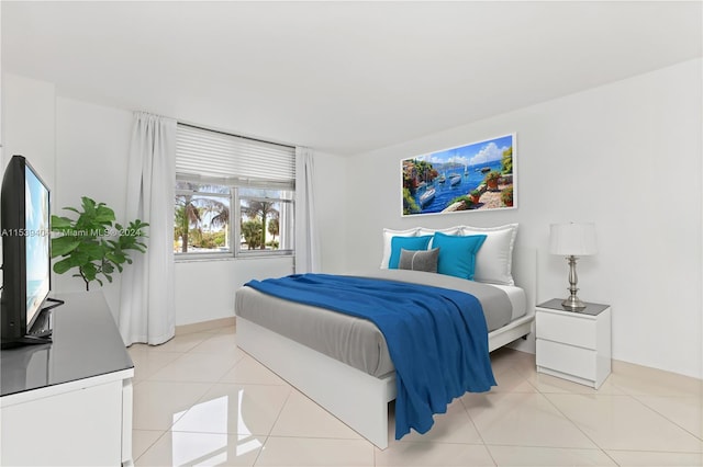 bedroom featuring light tile floors