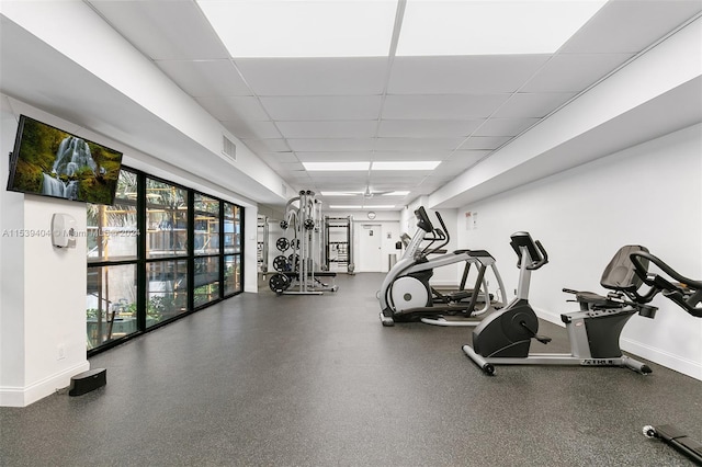 gym featuring a paneled ceiling