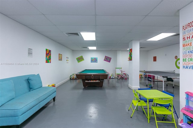 game room with a paneled ceiling and pool table