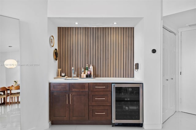 bathroom featuring tile flooring, wine cooler, and oversized vanity