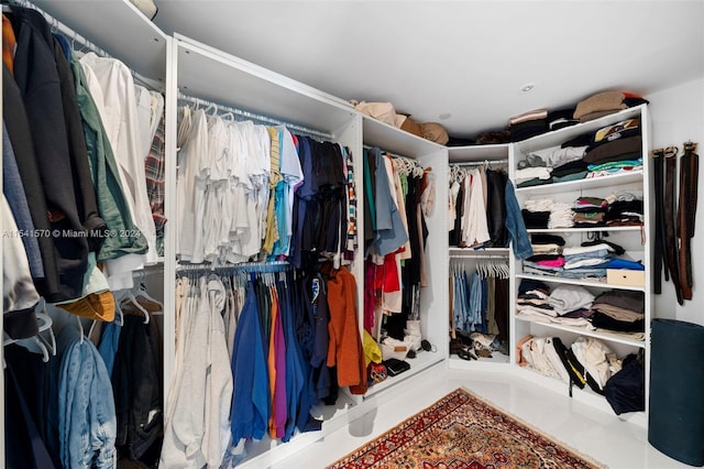 walk in closet featuring light tile floors