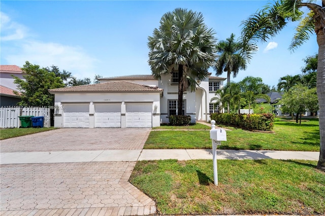 mediterranean / spanish-style house with a front yard