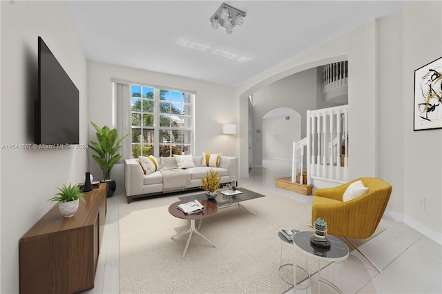 living room featuring light tile flooring