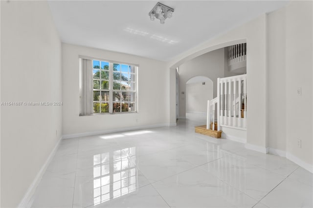 empty room featuring light tile flooring