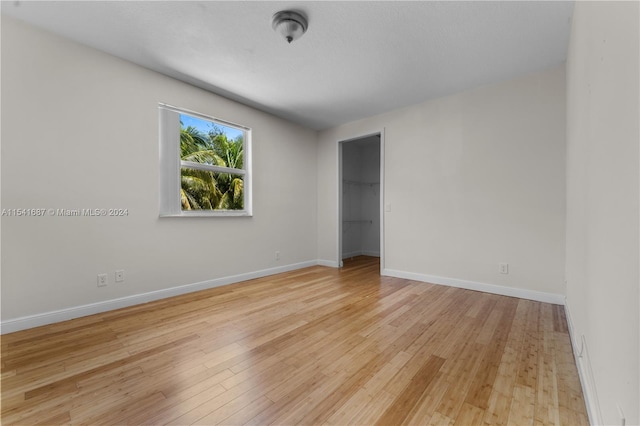 empty room with light hardwood / wood-style floors