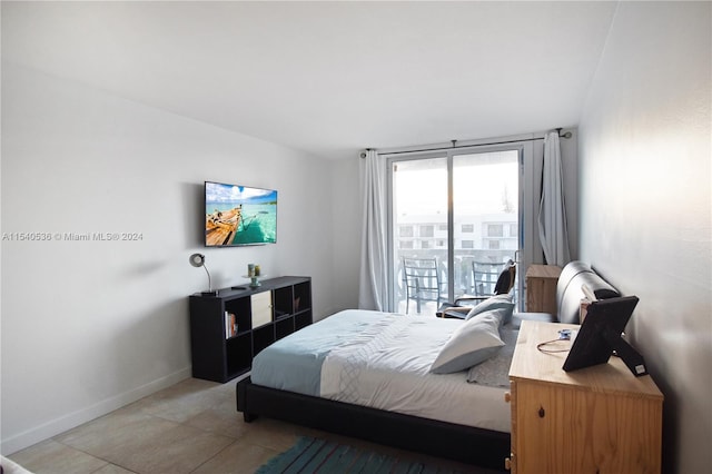 tiled bedroom with access to outside