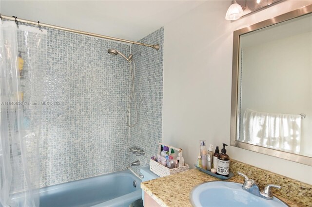 bathroom with vanity and shower / tub combo