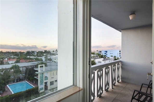 view of balcony at dusk