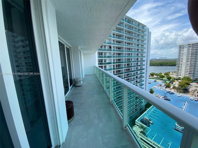 balcony featuring a water view