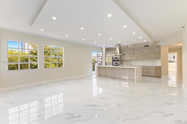 unfurnished living room featuring light tile floors