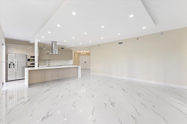 kitchen featuring island range hood, stainless steel appliances, light tile floors, tasteful backsplash, and a center island with sink