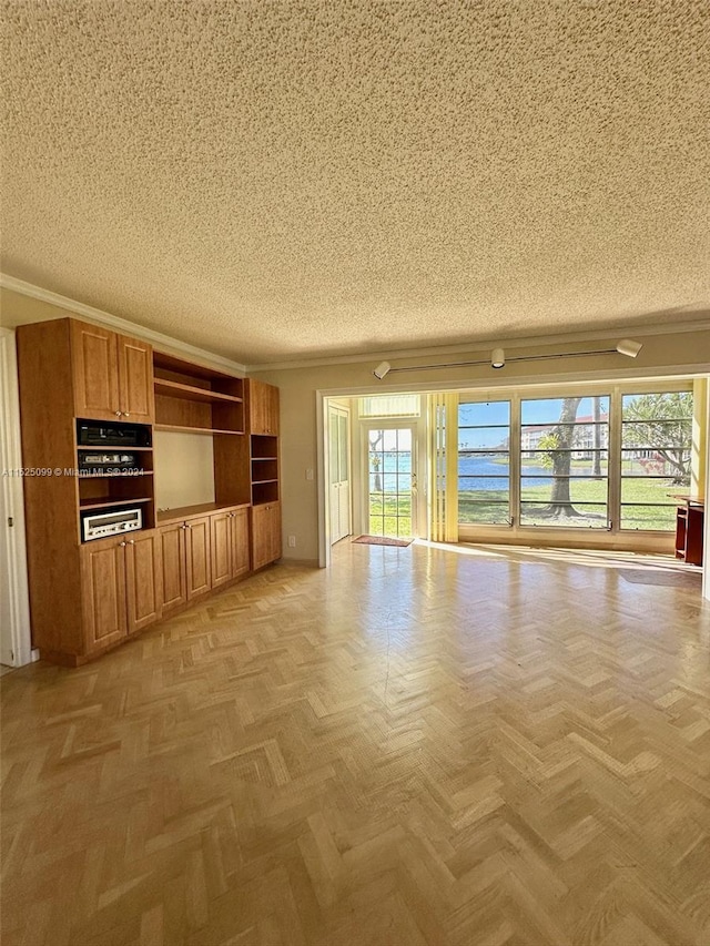 unfurnished living room with light parquet floors and a textured ceiling