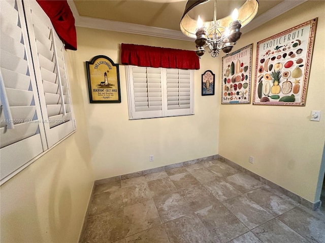 unfurnished room featuring ornamental molding, a chandelier, and tile floors