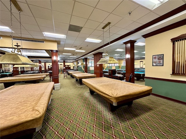 game room featuring a drop ceiling, carpet floors, ornate columns, and pool table