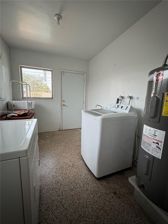 laundry area featuring electric water heater and washing machine and clothes dryer