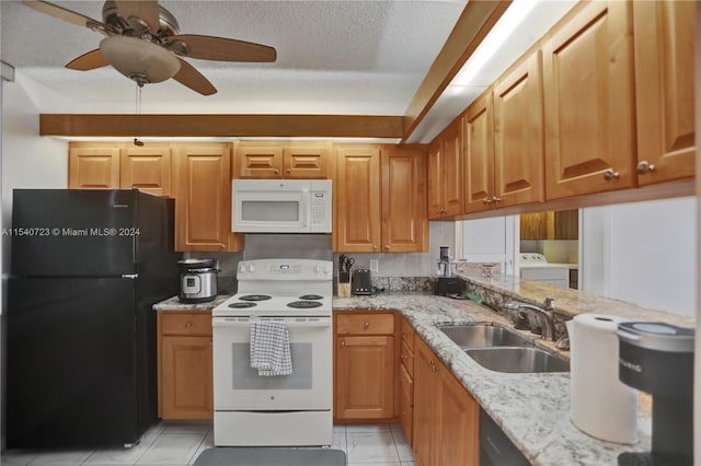 kitchen featuring white appliances, sink, light tile patterned floors, separate washer and dryer, and ceiling fan