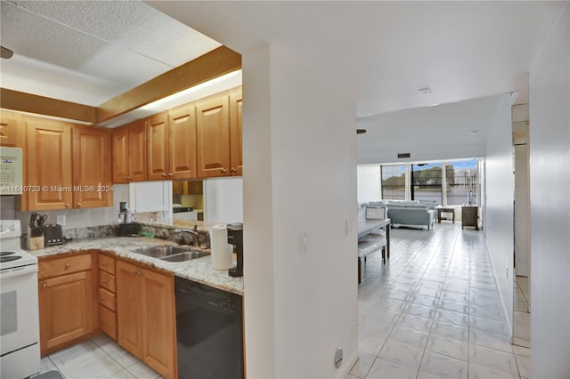 kitchen featuring sink, light stone countertops, white appliances, and light tile patterned floors