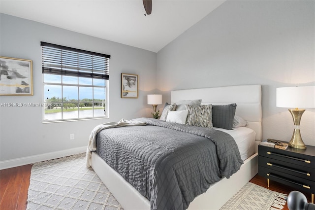 bedroom featuring light hardwood / wood-style flooring, ceiling fan, and lofted ceiling