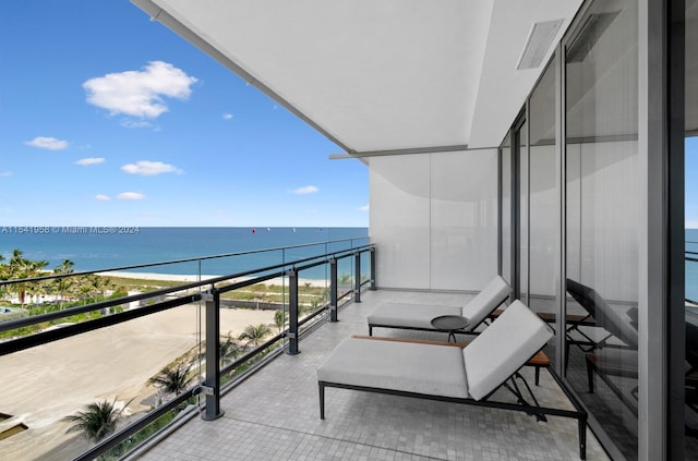 balcony featuring a water view