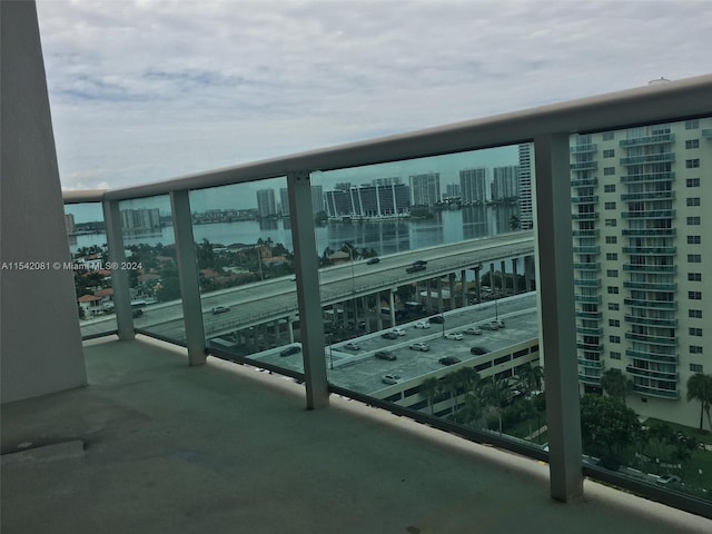 balcony featuring a water view