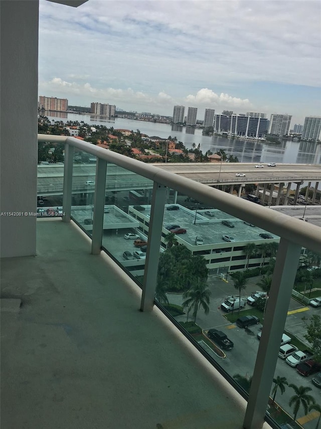 balcony featuring a water view