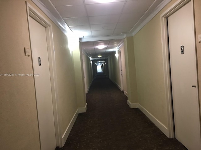 hallway with a drop ceiling