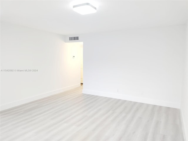 spare room featuring light hardwood / wood-style flooring