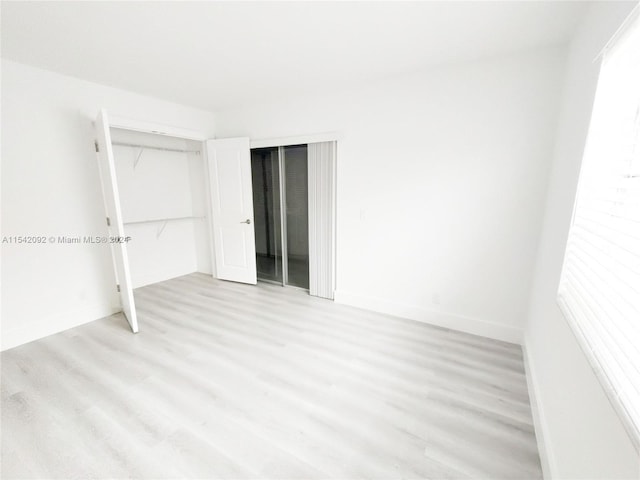 unfurnished bedroom featuring a closet