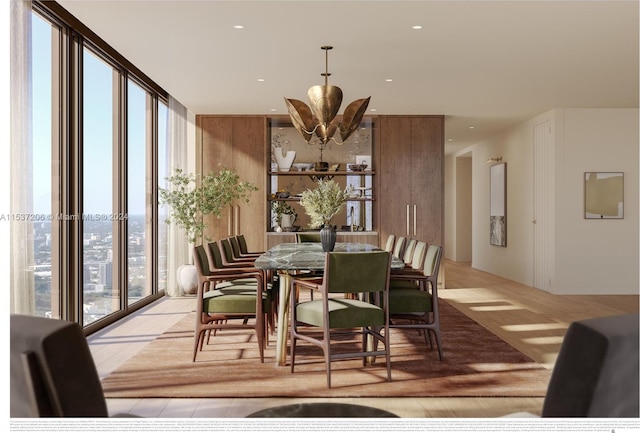 dining area with a wall of windows, a chandelier, and light hardwood / wood-style flooring