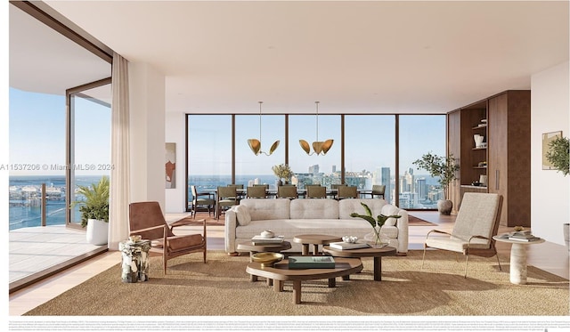 living room with a water view, expansive windows, and light wood-type flooring