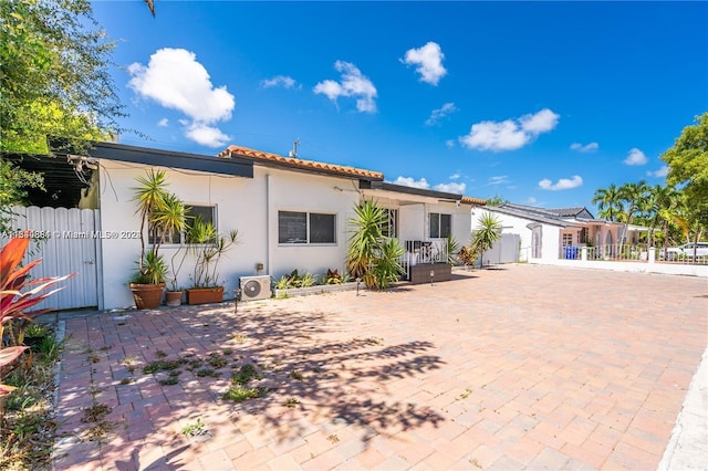 rear view of house with a patio