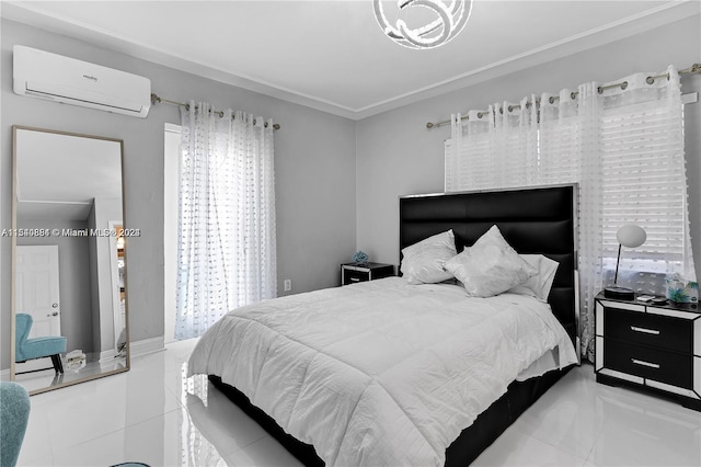 bedroom with light tile floors, crown molding, and an AC wall unit