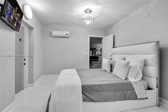 tiled bedroom featuring a wall mounted AC