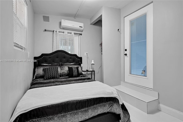 bedroom with a wall mounted air conditioner