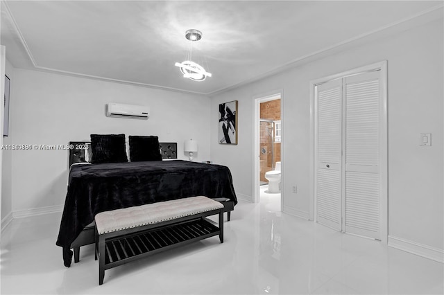 tiled bedroom featuring a wall mounted AC, ensuite bathroom, a closet, and a notable chandelier