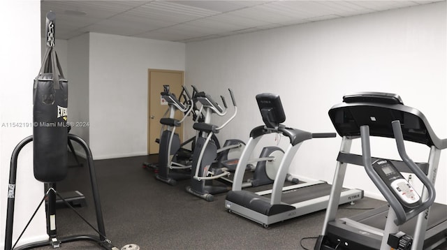 exercise room featuring a drop ceiling