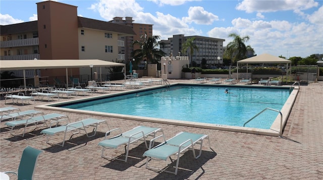 view of swimming pool with a patio area