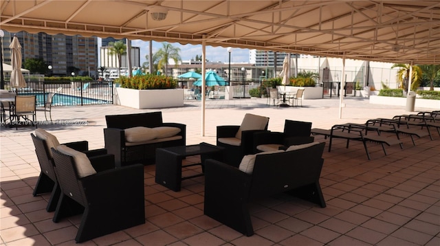 view of patio / terrace featuring outdoor lounge area and a community pool