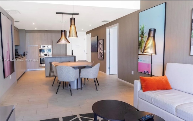 dining area featuring light wood-type flooring