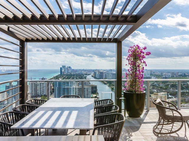 balcony featuring a water view