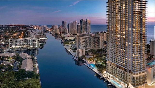 aerial view at dusk with a water view