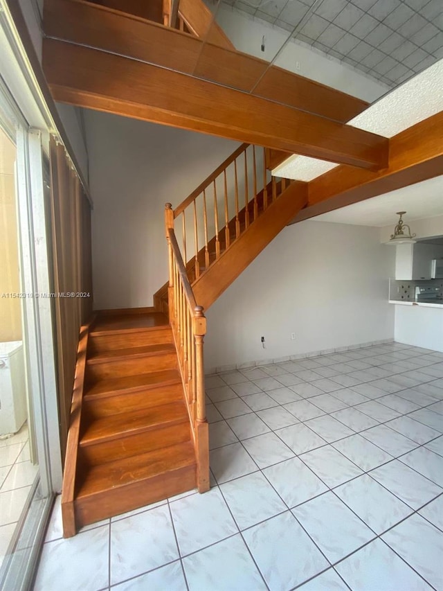 staircase with light tile flooring